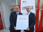 Dr. Peter Ramsauer (Right), Federal Minister of Transport, Building and Urban development handing over the certificate of Official Partners and City Partners to Dr. Joerg Strassburger, Managing Director and Country Representative, LANXESS India