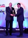 Mr. Neelanjan Banerjee (right) receiving the award from Mr. V. K. Misra, Technical Director – JK Tyres & Industries Ltd.